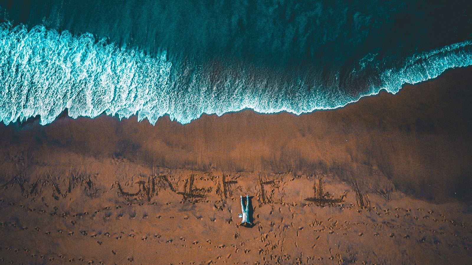 Download wallpapers man, ocean, view from above, shore, surf