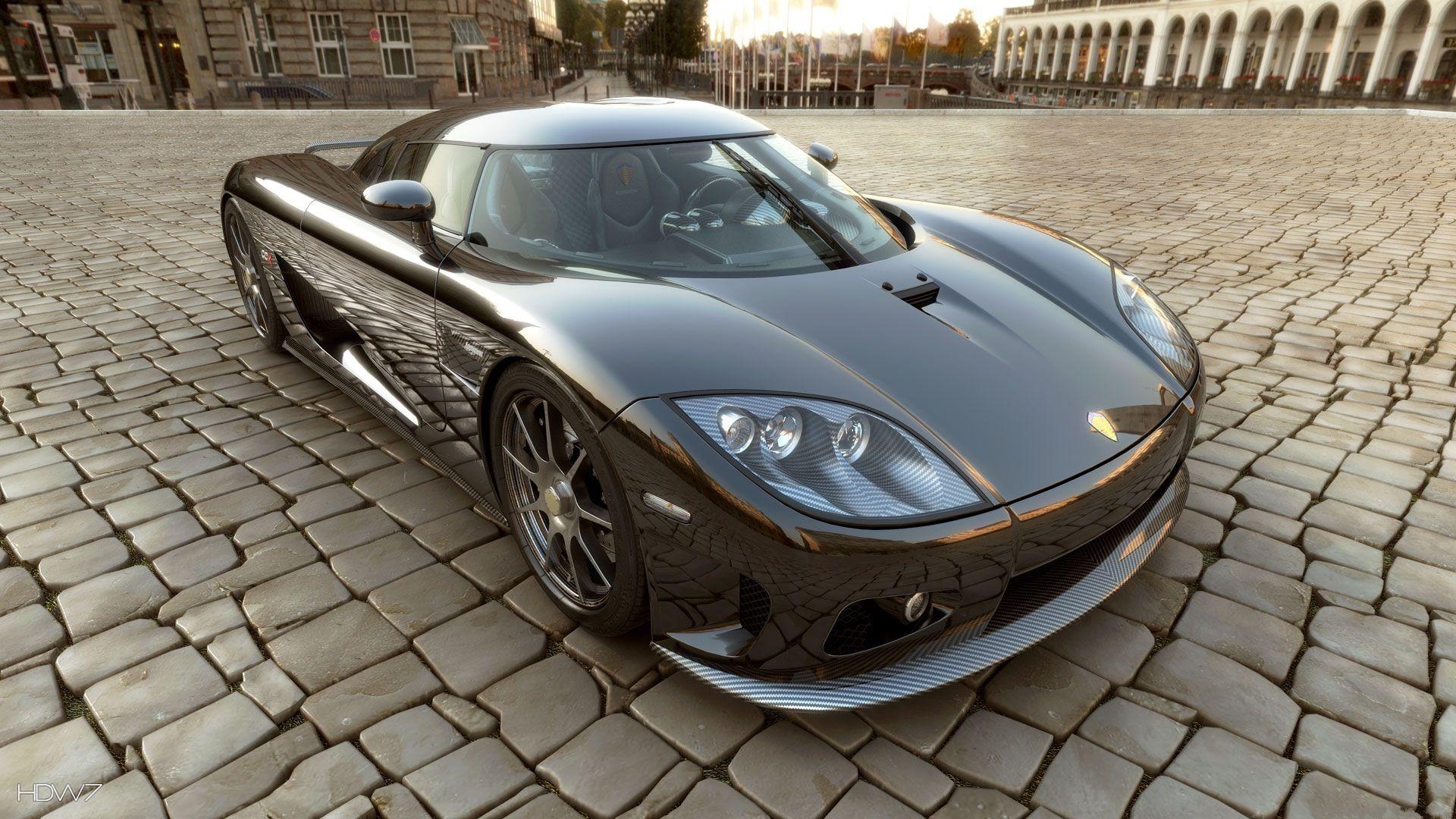 koenigsegg ccr super sports car on a pavement wallpapers