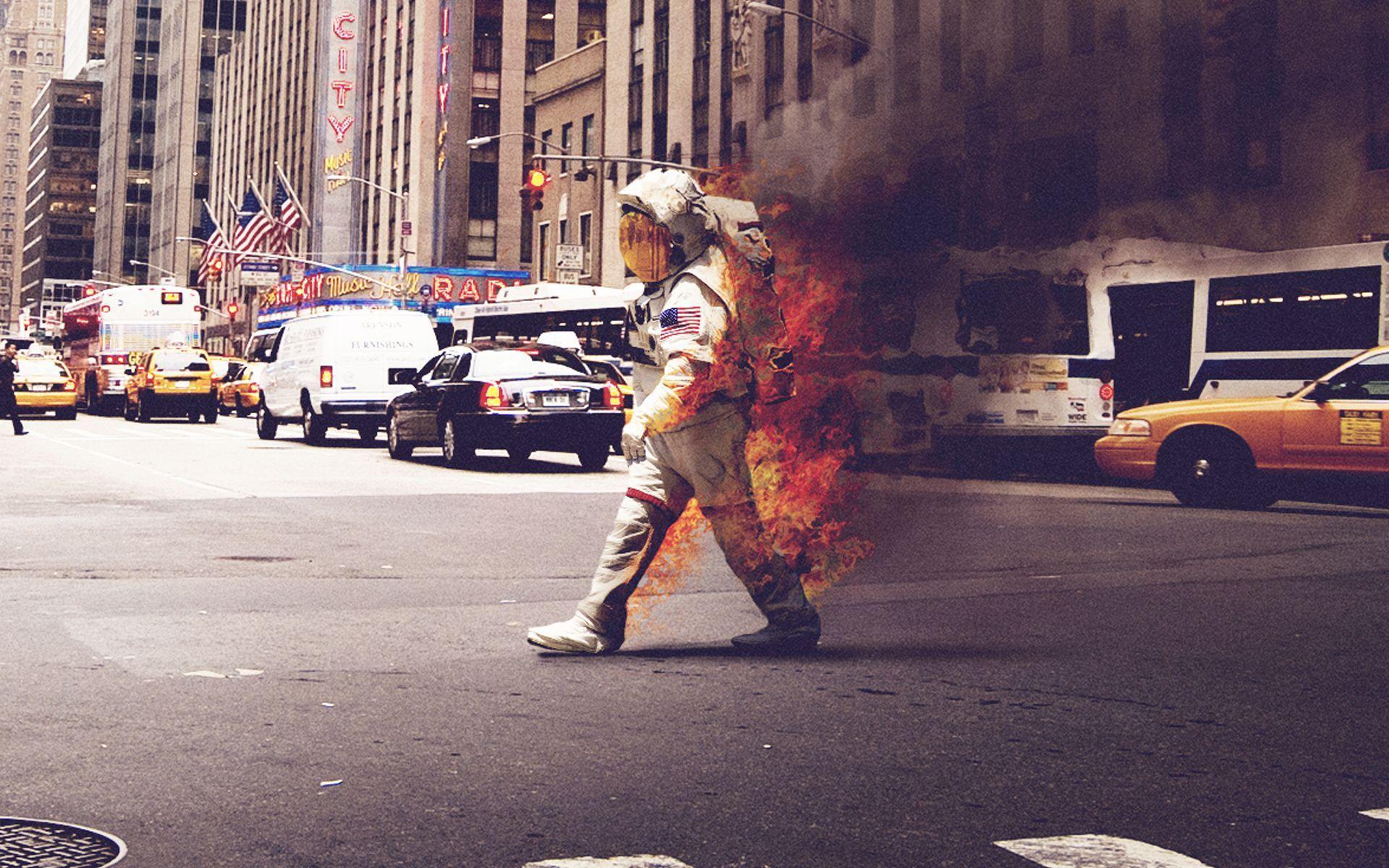 Astronaut on Fire walking down a street : wallpapers