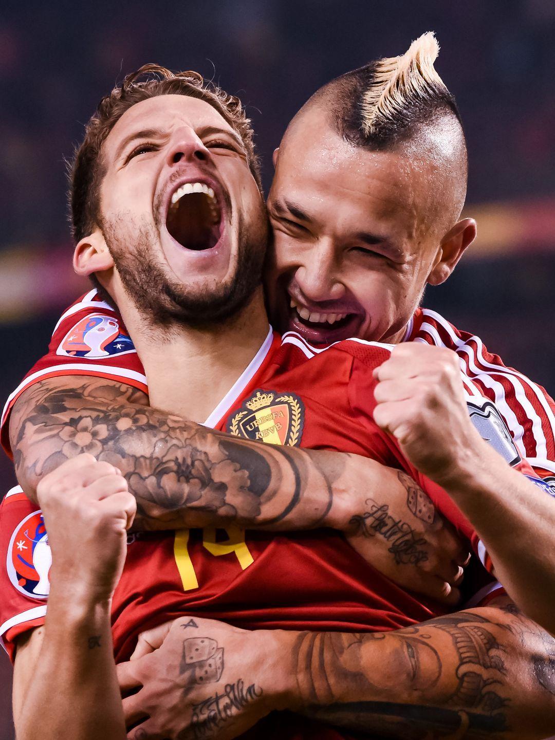 Belgium’s Dries Mertens, left, celebrates with teammate Radja