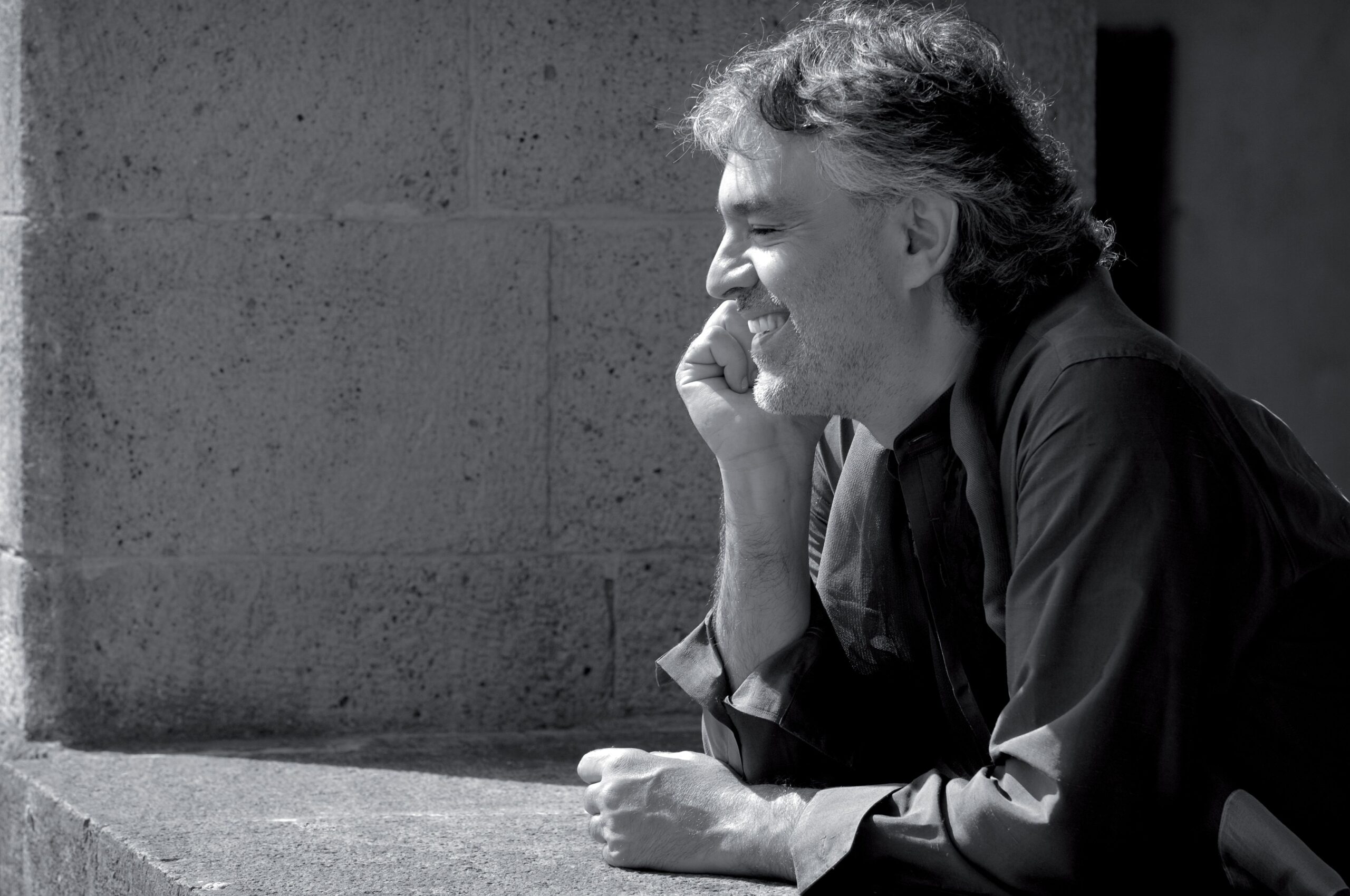 Andrea Bocelli covering his face while outside his Manhattan hotel