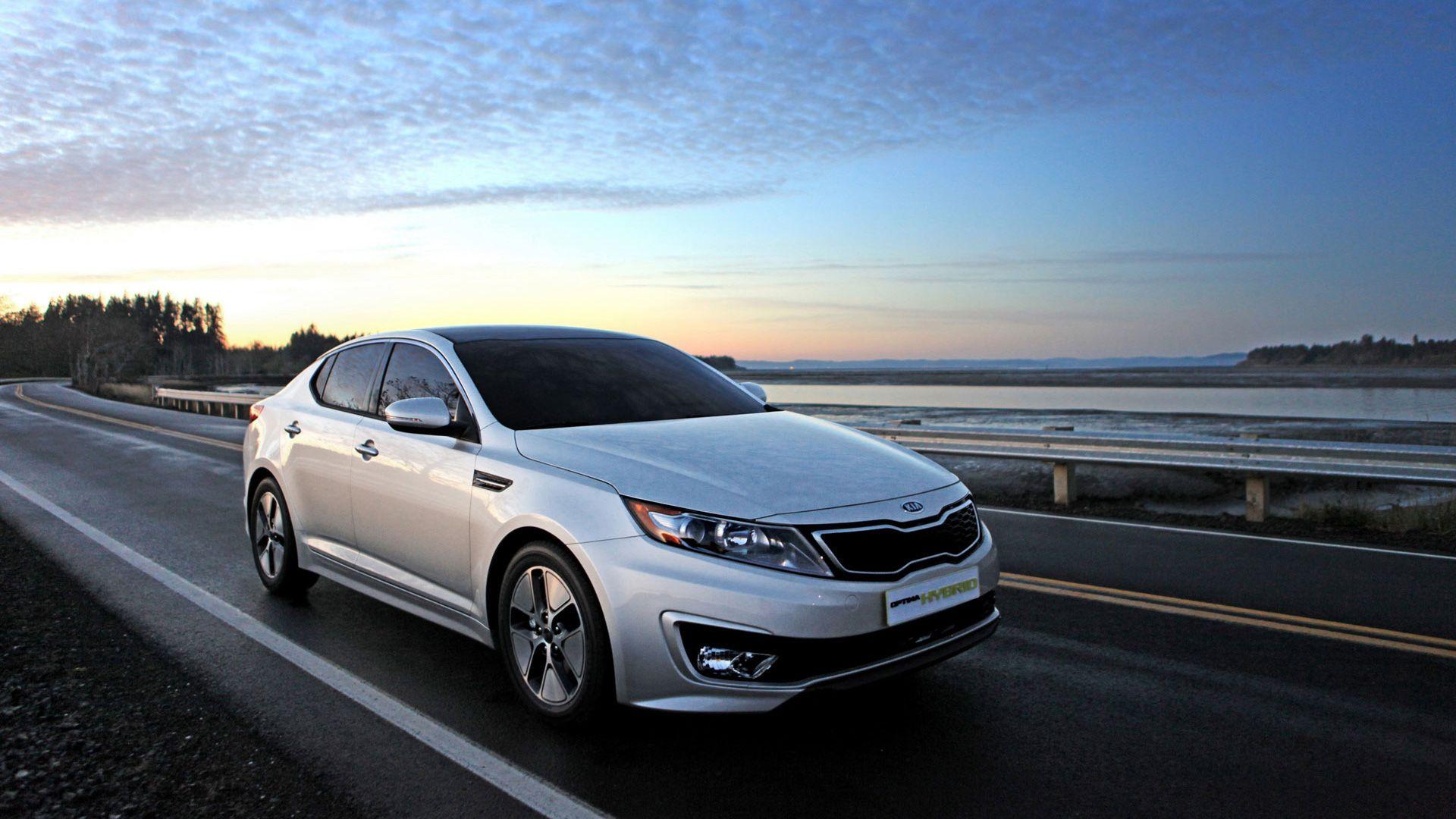 Kia Optima Hybrid Running on Highway Wallpapers