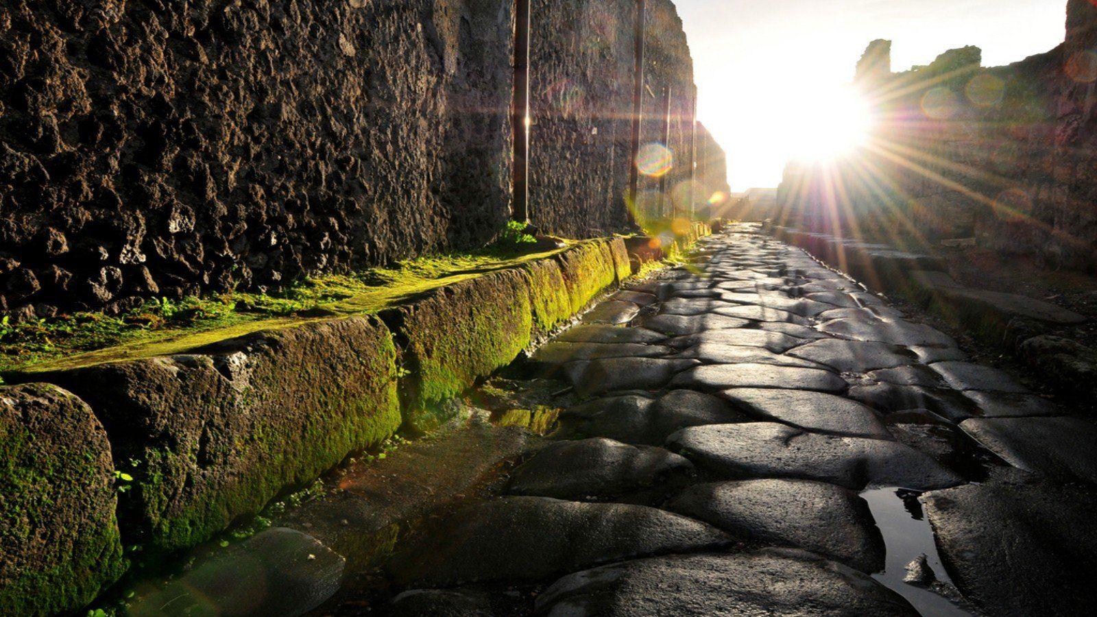 Ruins Italy moss antique cobblestones Italia Pompei street sun flare