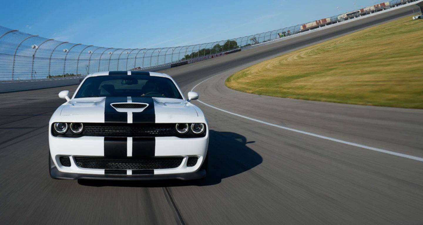 2019 Dodge Challenger white black color on racing track full speed