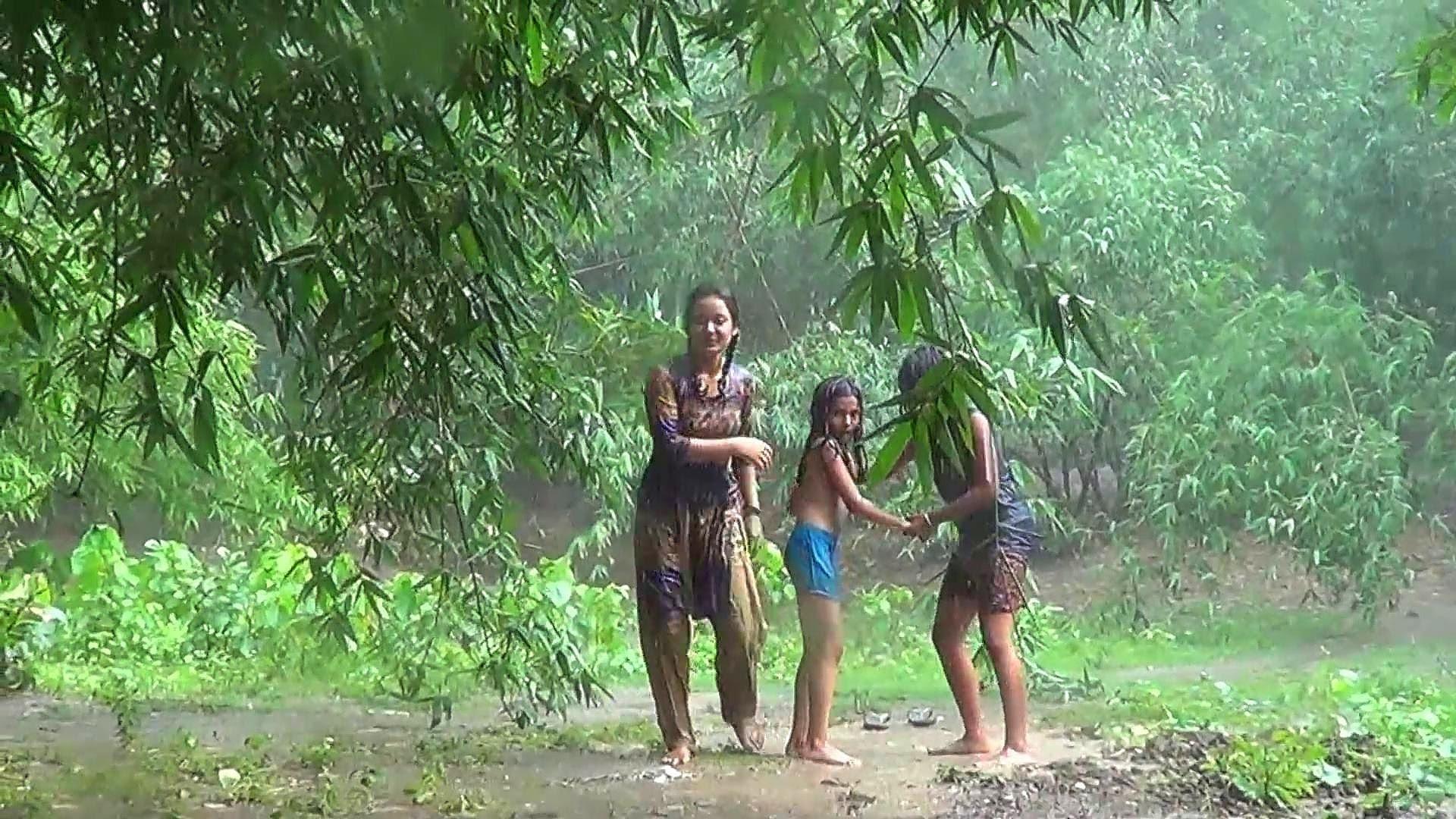 Villege girl bath rain Bangladesh []