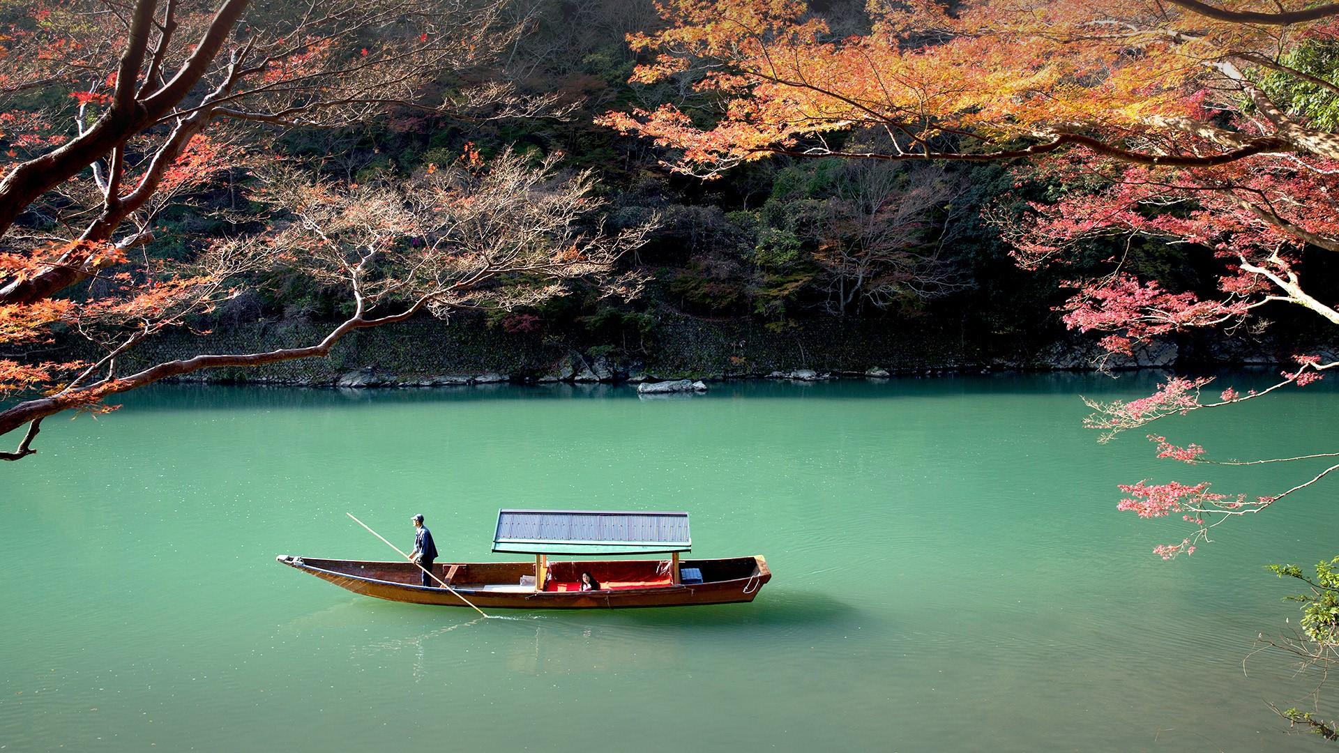 Rowing boat on Katsura river, Arashiyama, Japan