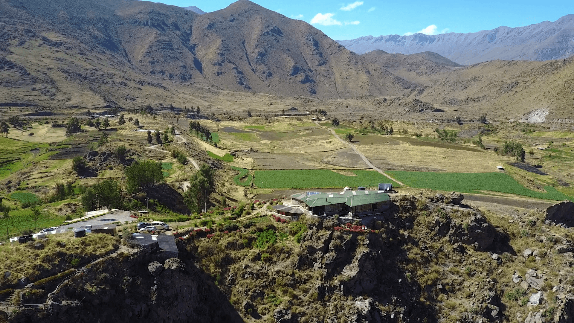 Drone aerial flying backwards away from a beautiful house