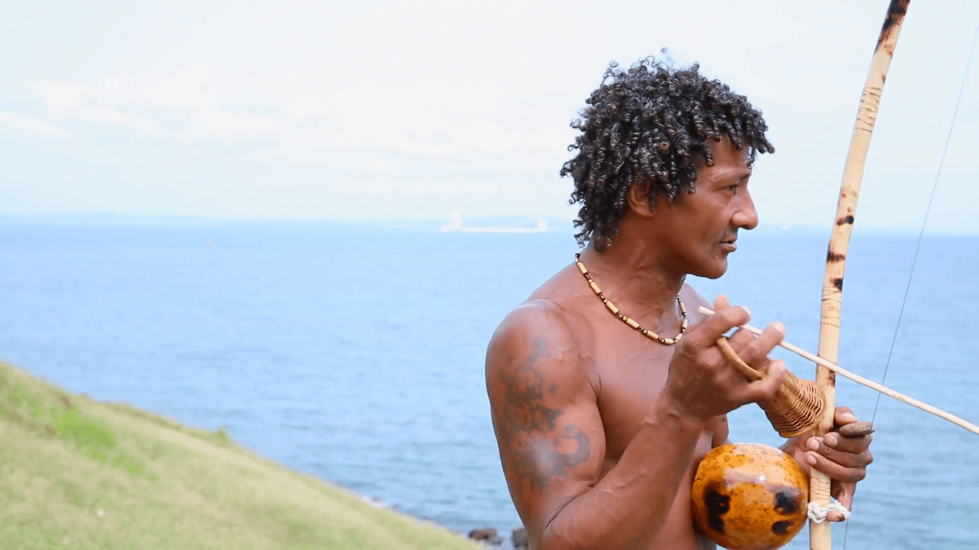 Brazilian playing Berimbau Instrument in Salvador, Bahia, Brazil