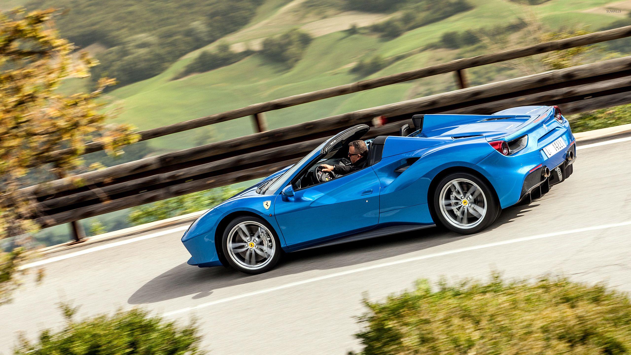 Blue Ferrari 488 Spider on the road wallpapers