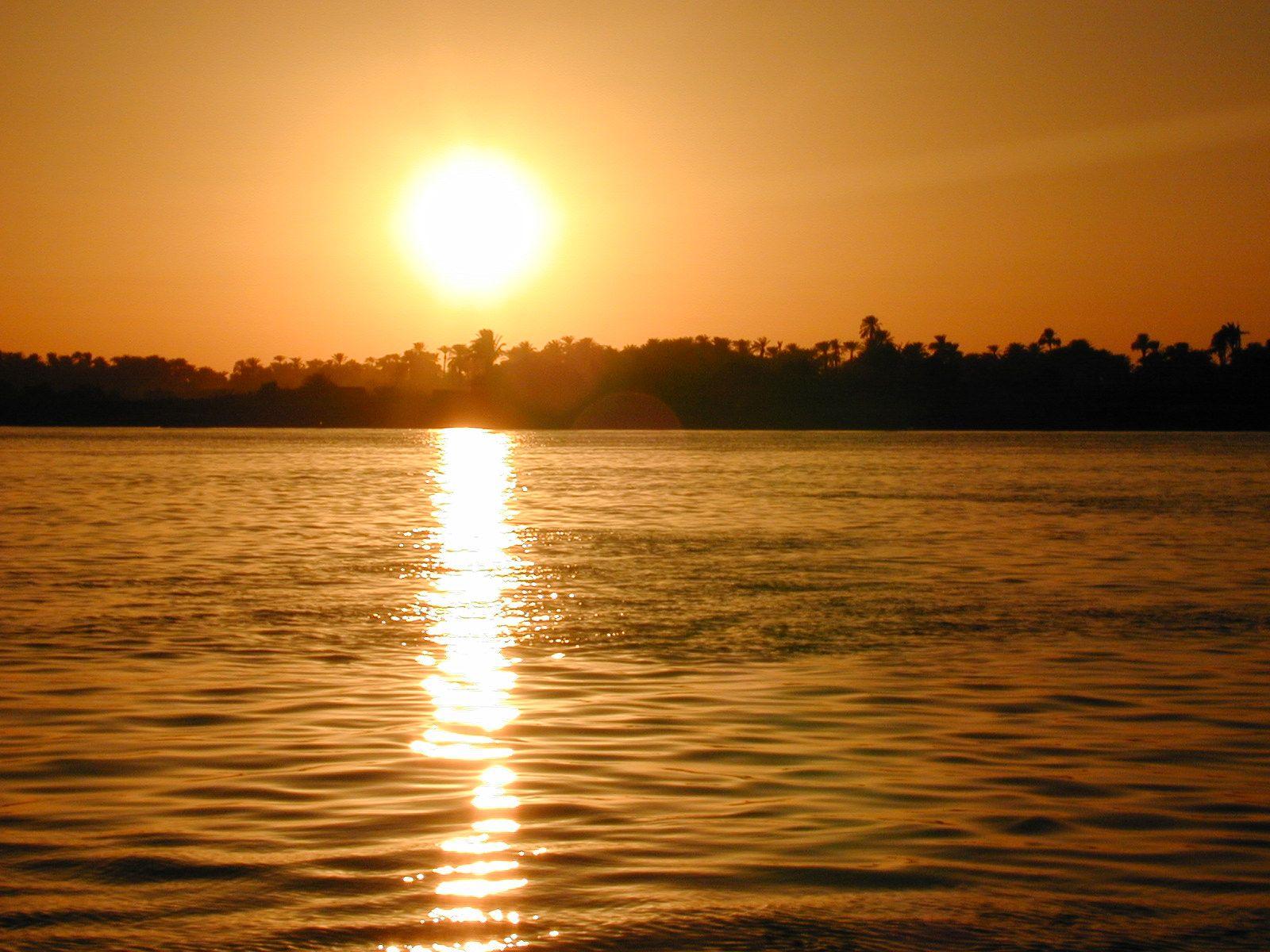 River’s Edge: In this photo: Sun sets over the Nile River, which