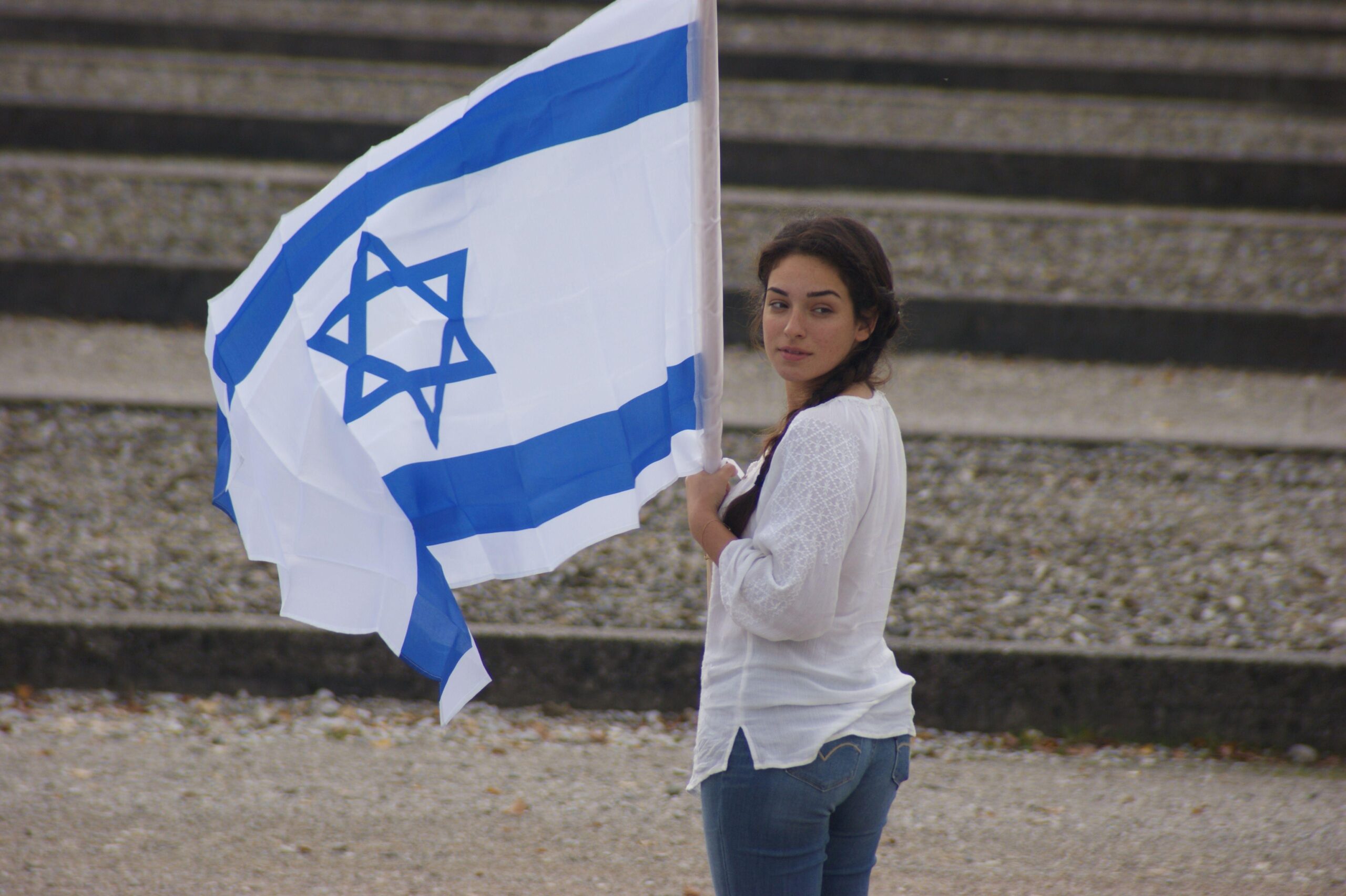 women’s white long sleeve shirt and blue denim jeans and israel