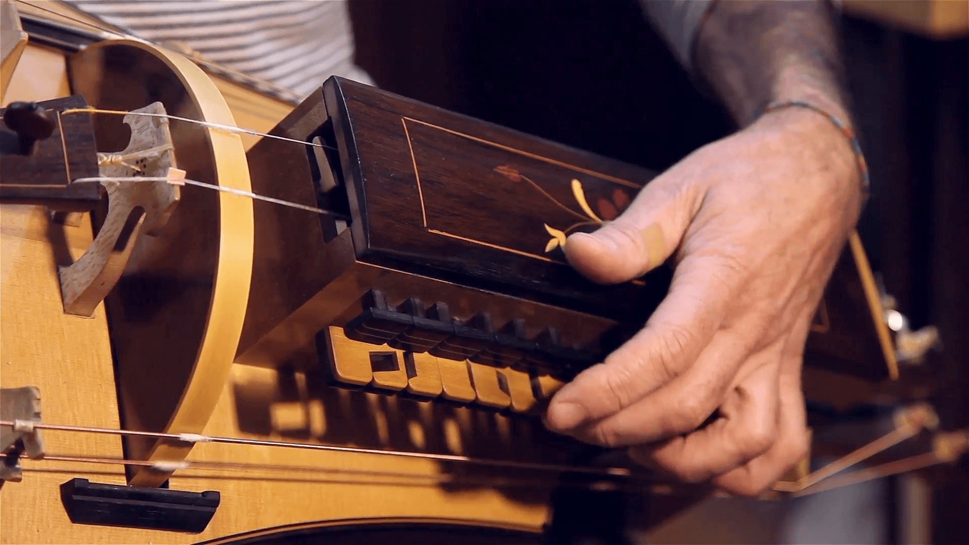 man playing old accordion called Sanfona Hurdy