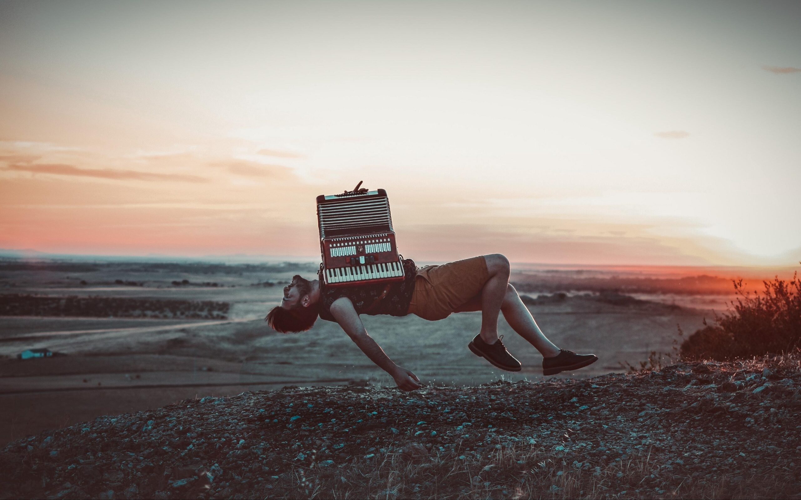 Download wallpapers accordion, levitation, musician, flight