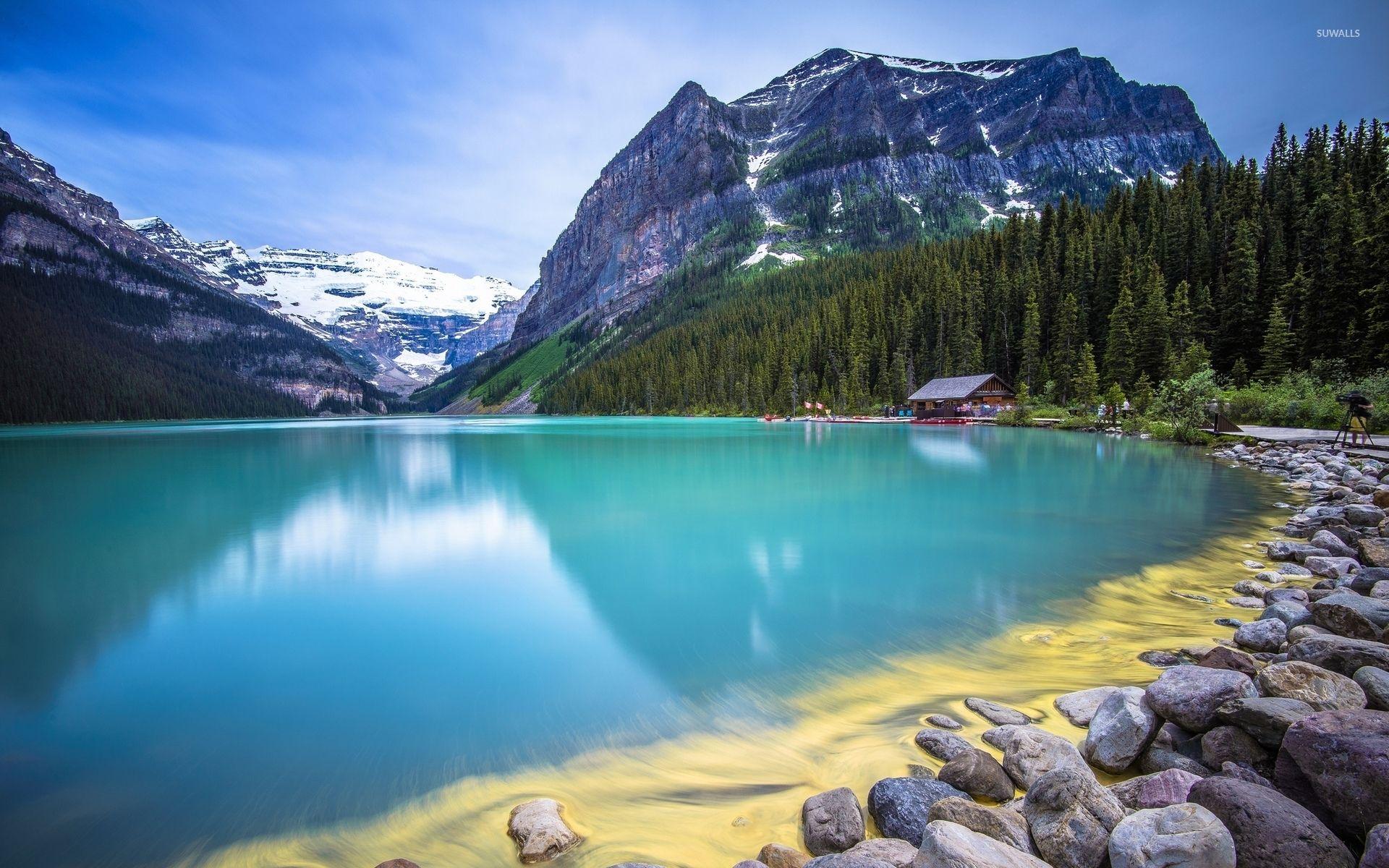 Amazing turquoise water lake guarded by rocky mountains wallpapers