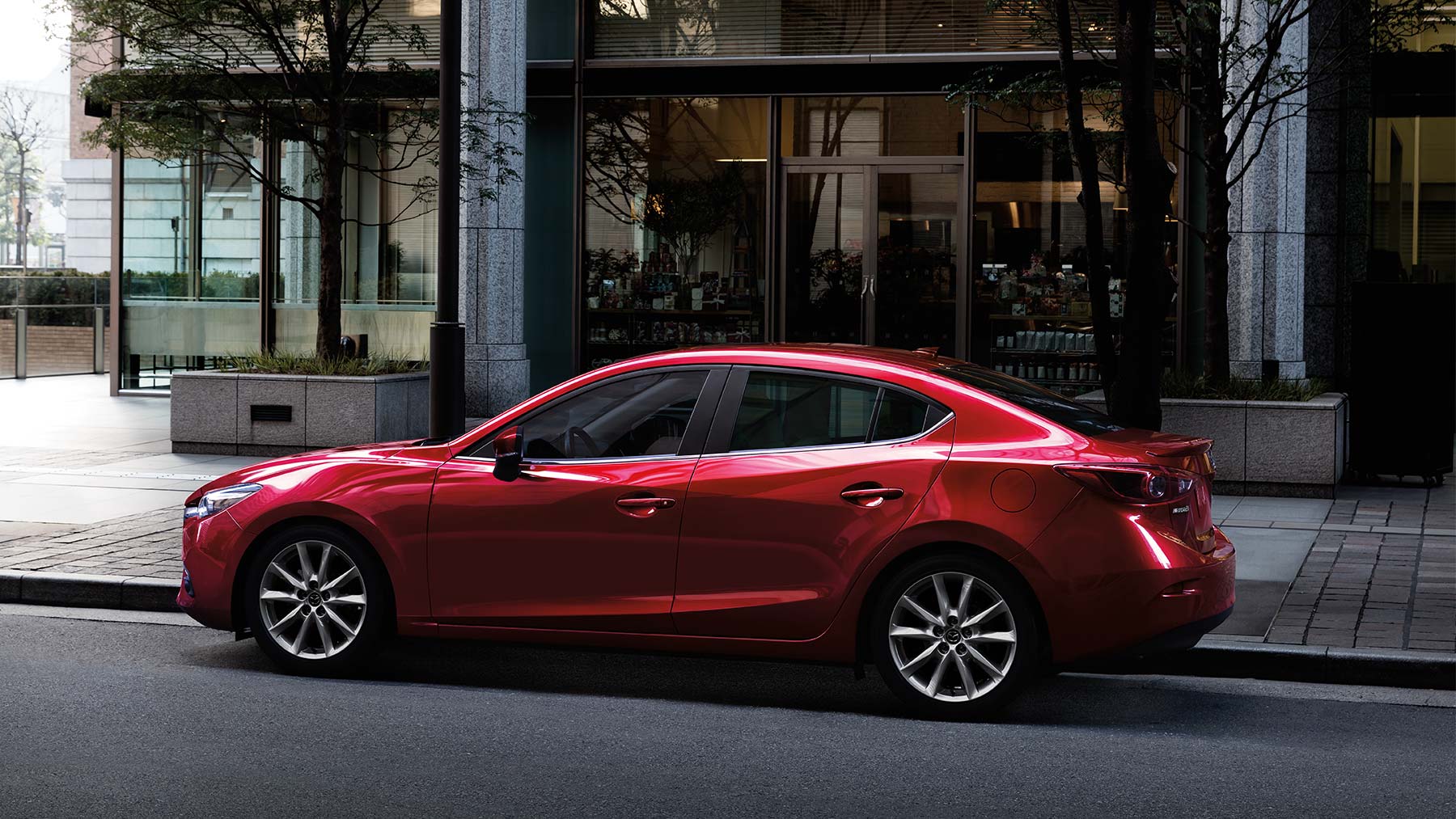 2019 Mazda 3 red color on road in city 4k hd wallpapers