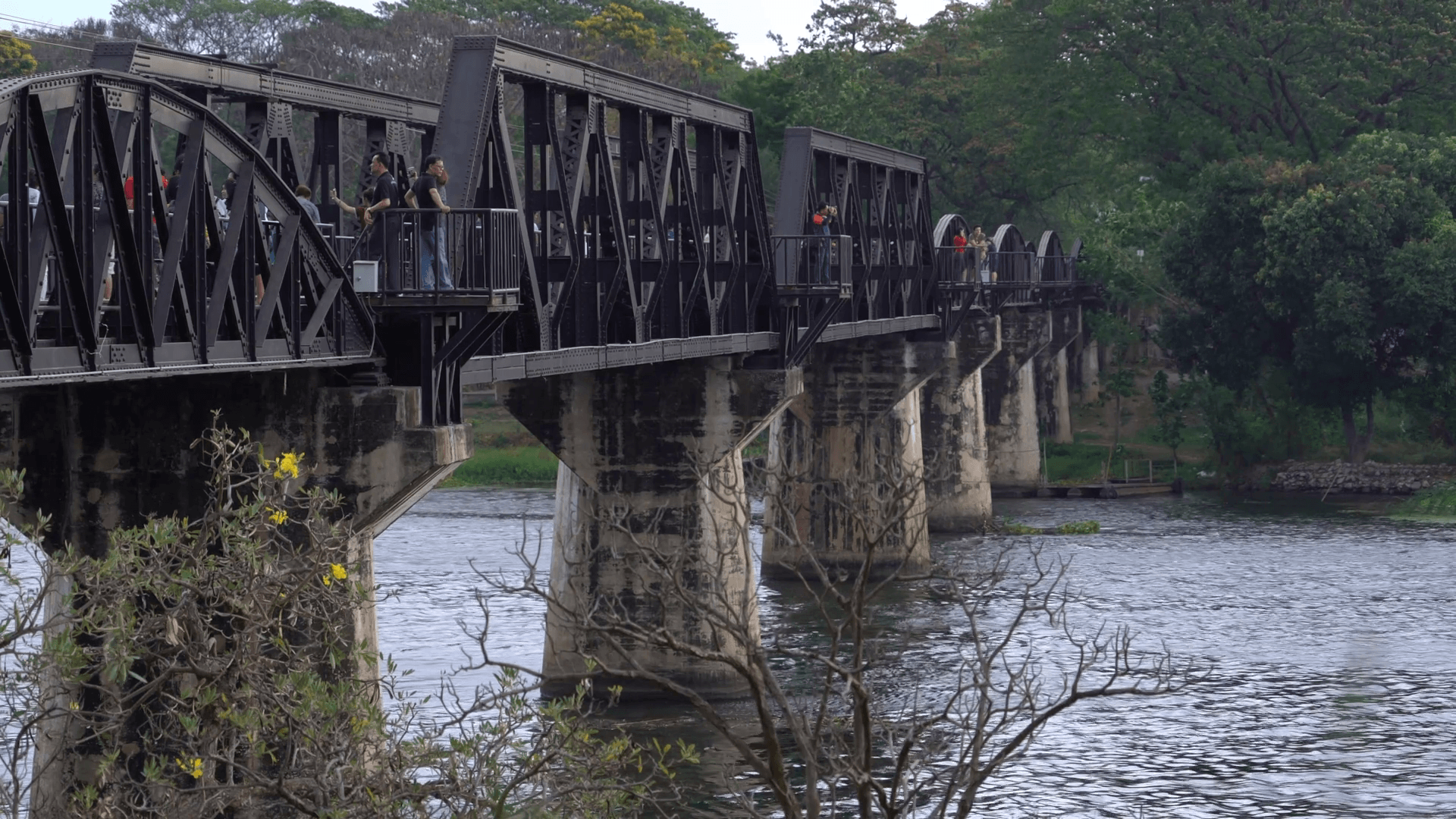 Vistors walk the famous Bridge on the River Kwai, in Kanchanaburi