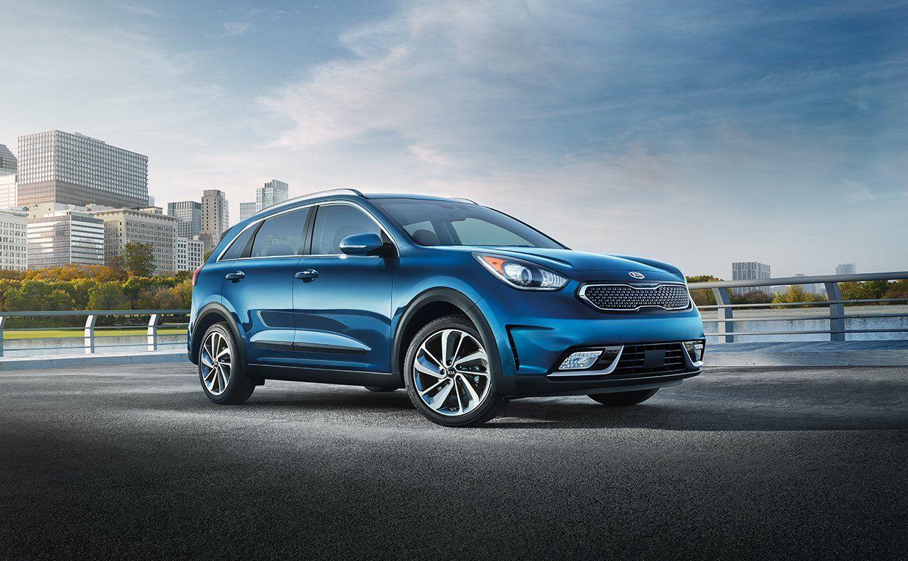 2019 Kia Niro EV blue color park side view lake side 4k hd wallpapers