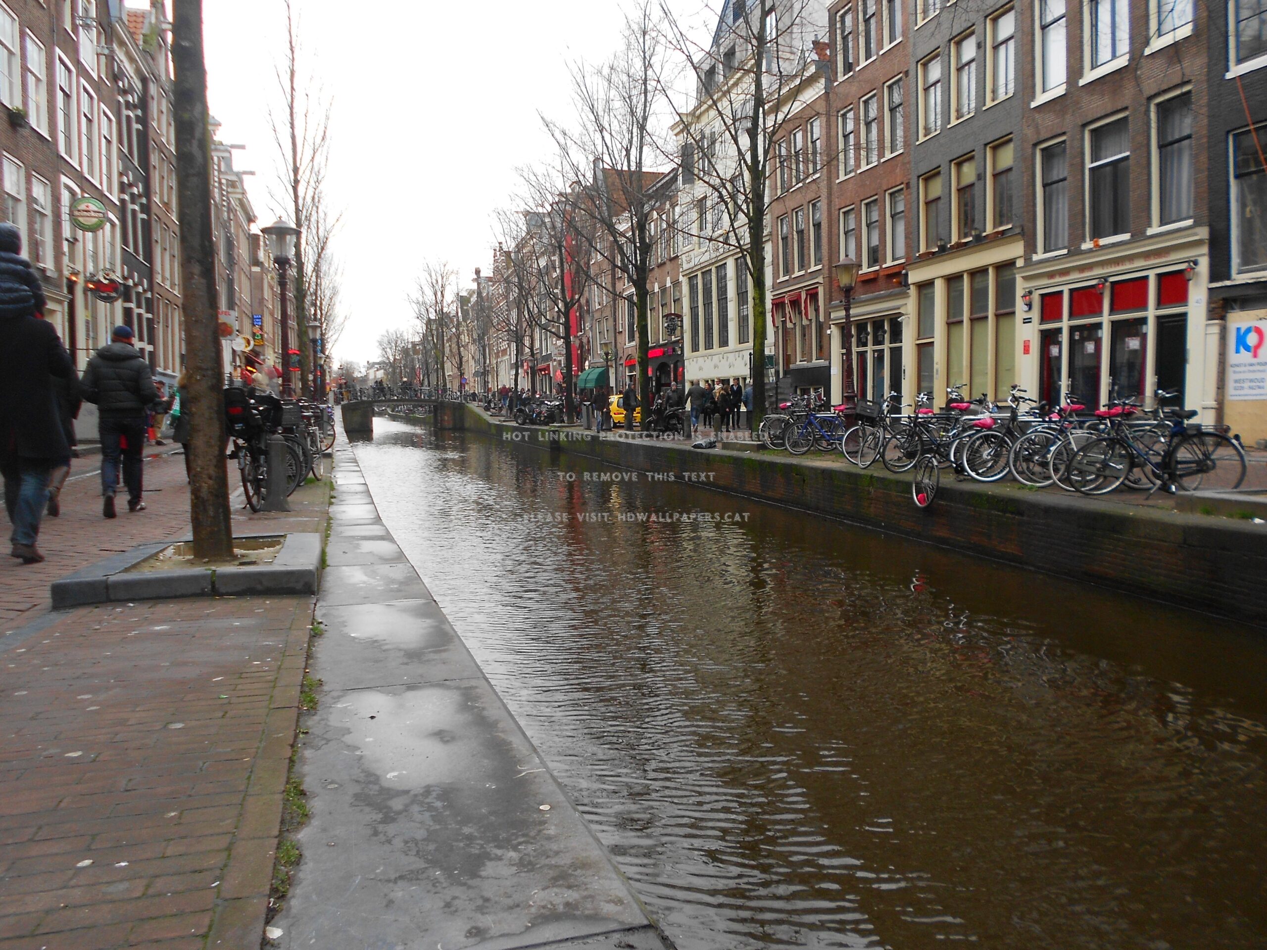 red light district in amsterdam canal day