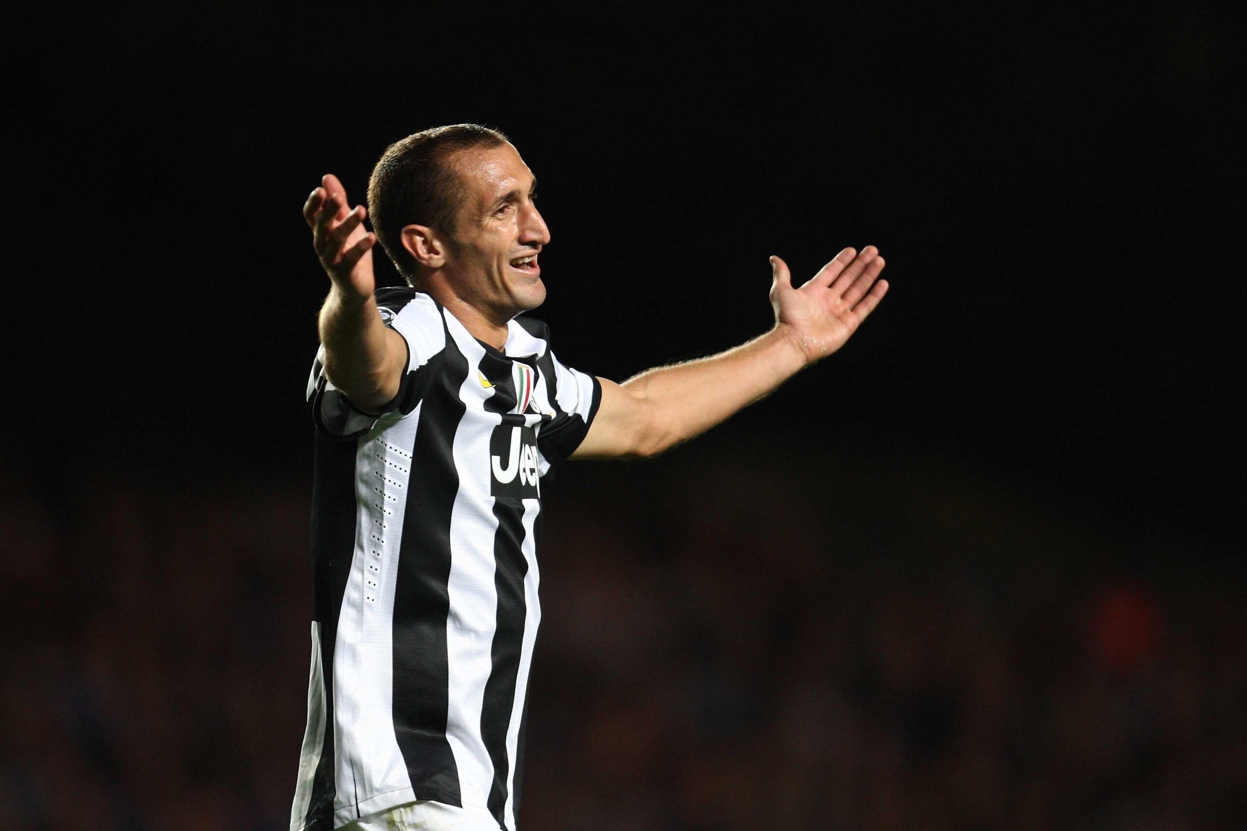 The player of Juventus Giorgio Chiellini on black backgrounds