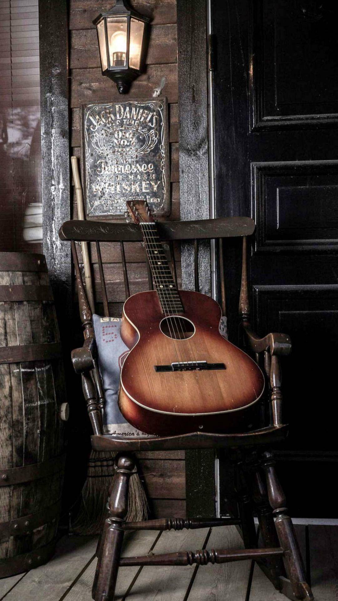 Old Guitar On Chair