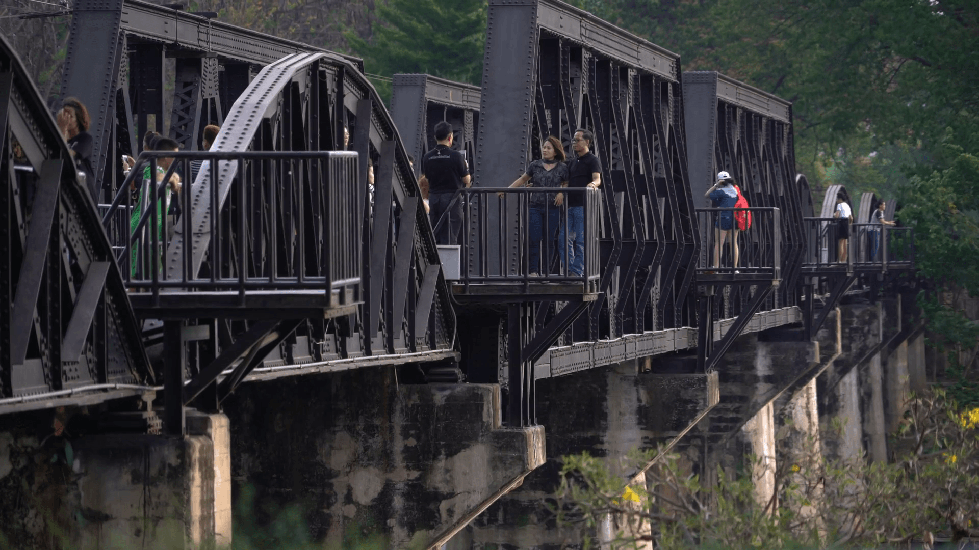 Vistors walk the famous Bridge on the River Kwai, in Kanchanaburi