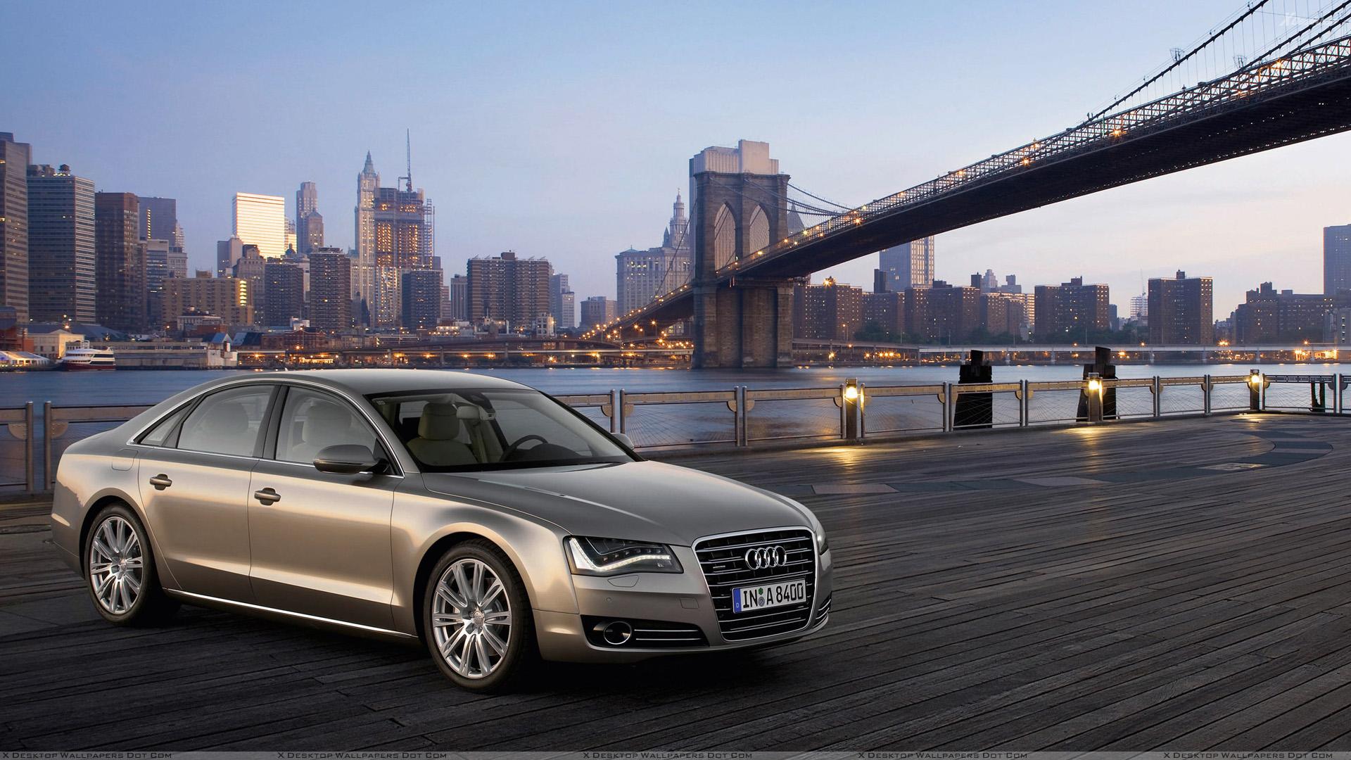 2011 Audi A8 Side Front Pose In Golden Wallpapers