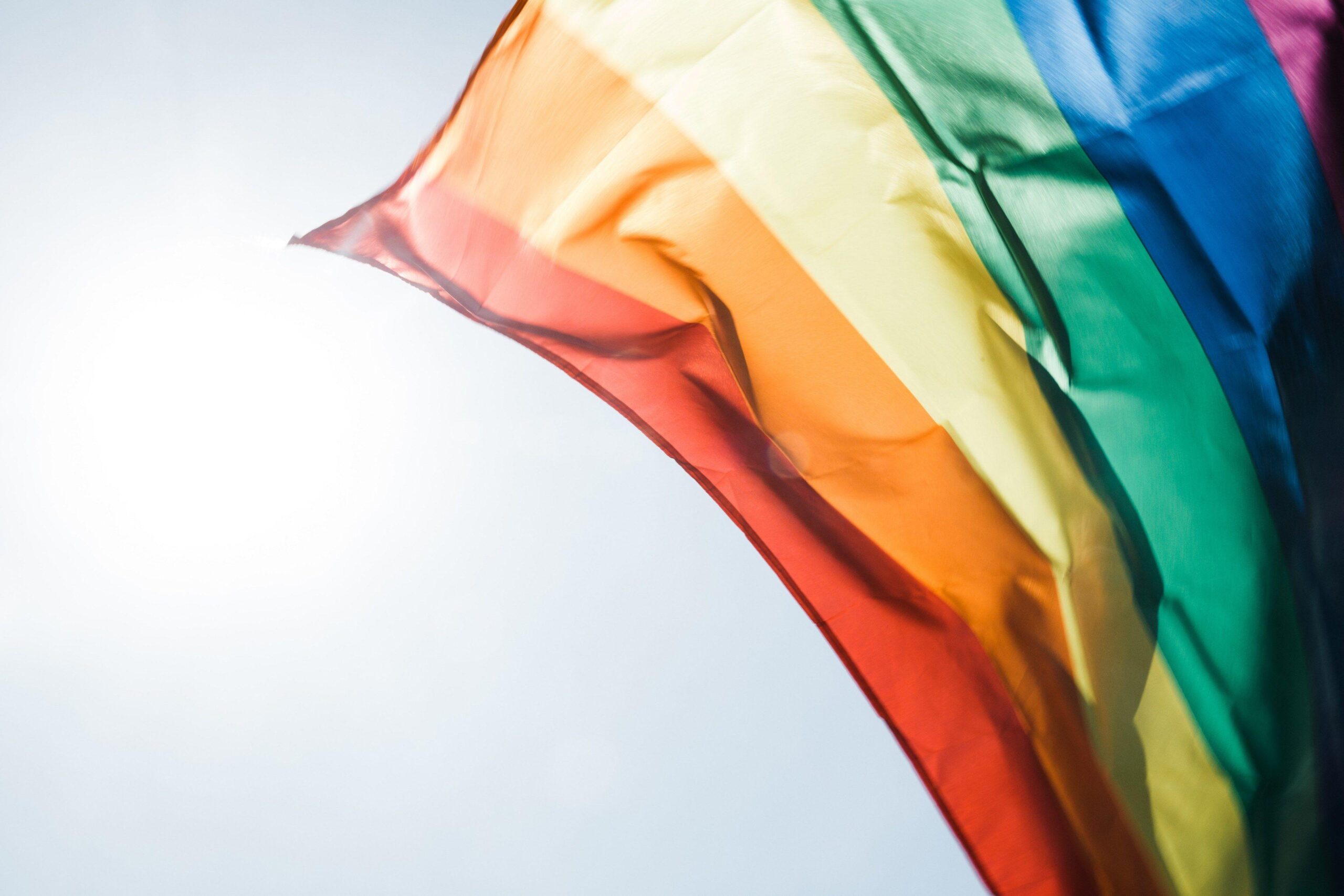 rainbow pride flag flying in the daytime breezeproud rainbow flag 4k