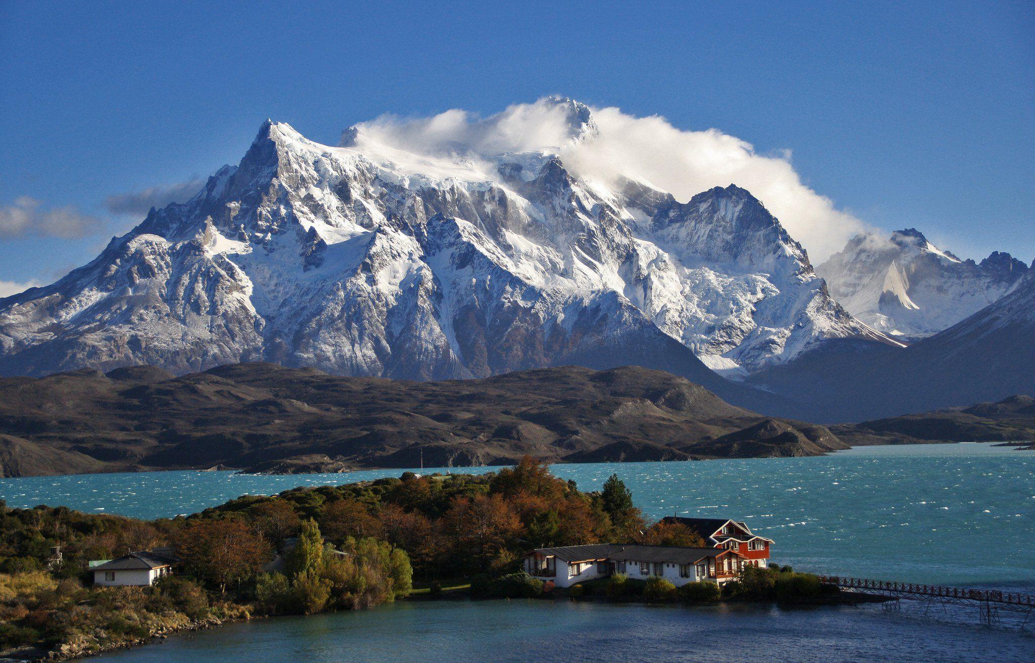 Patagonia Chile sky clouds mountains snow lake house trees nature