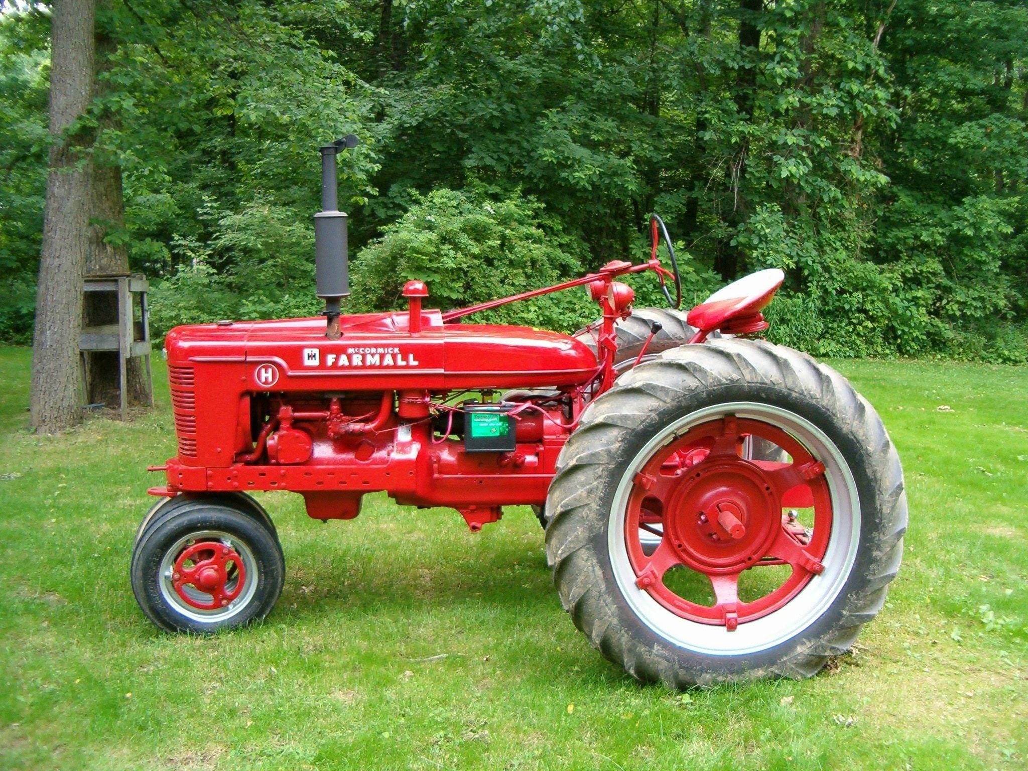 red and black farmall tractor free image