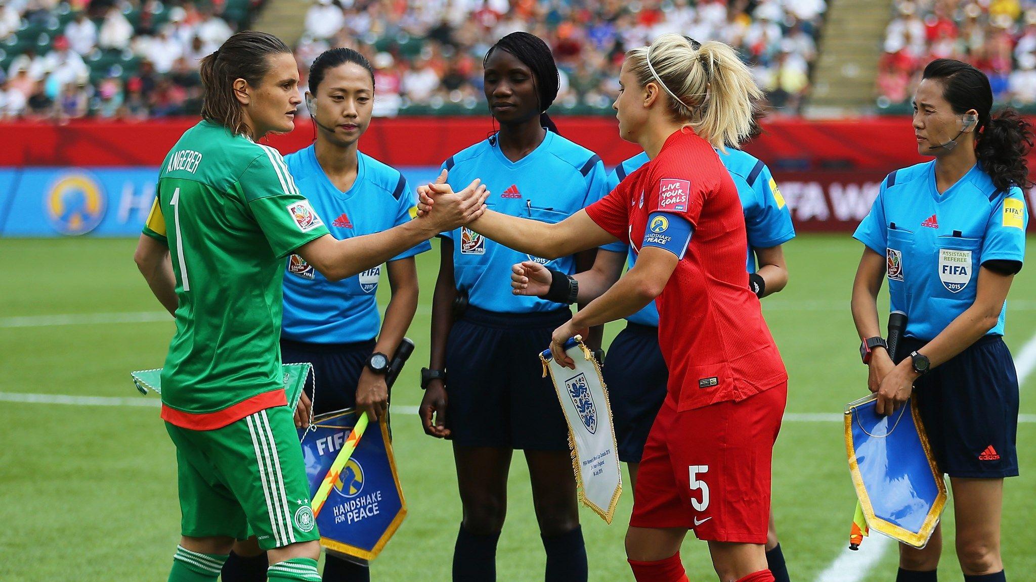 Nadine Angerer of Germany and Steph Houghton of England shake